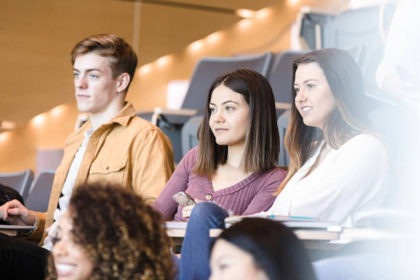 istock Male and female students listent attentively during lecture 1213739047