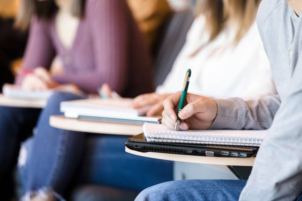 istock Closeup of unrecognizable college student taking notes 1213739061