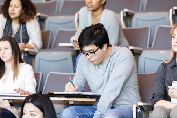 istock Asian male college student taking notes 1213739065
