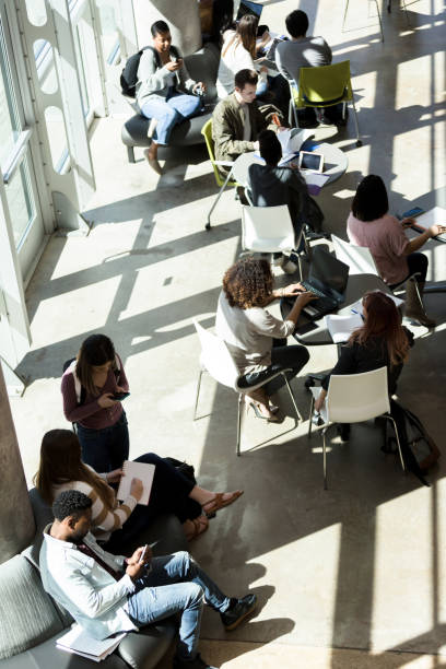 istock High angle view crowded lobby at community college 1213739129