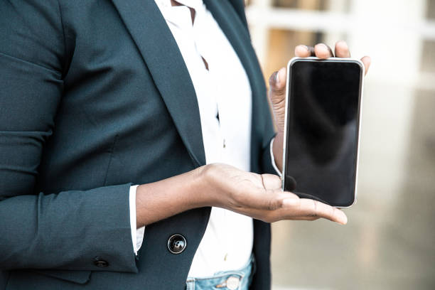 istock Business woman presenting new mobile app 1213740684