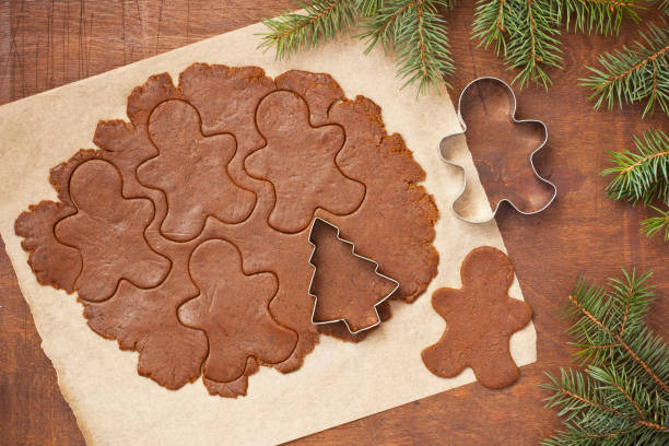 istock Cookie dough in the shape of  gingerbread mans 1213740861