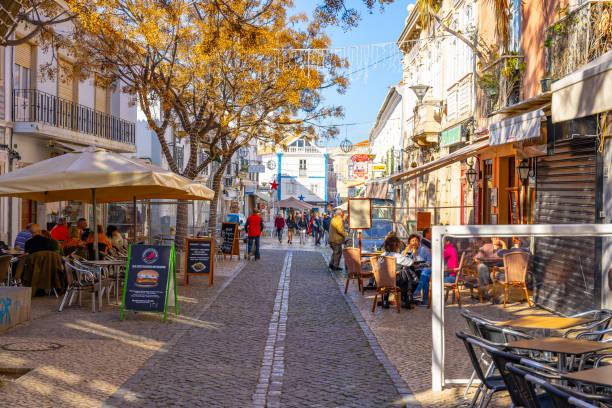 Lagos old town, Algarve, Portugal. This pic shows Street in the old town in the center of Lagos, Algarve region, Portugal. Narrow street in Lagos, Algarve, Portugal. lagos portugal stock pictures, royalty-free photos & images