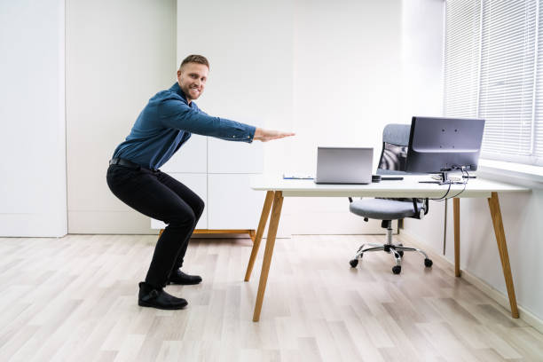 istock Smiling Young Businessman Doing Sit-ups 1213741268