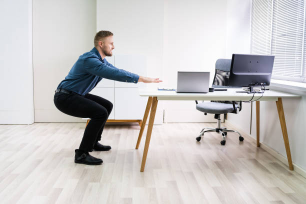istock Smiling Young Businessman Doing Sit-ups 1213741301