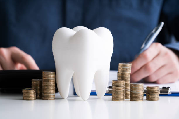istock White Tooth In Front Of Man Calculating Bill 1213741459