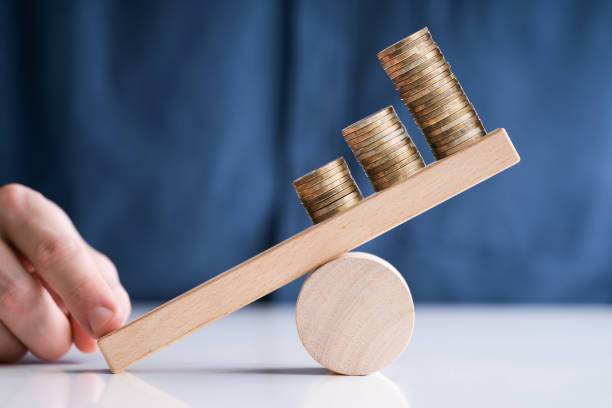 istock Businessperson Balancing Increasing Stacked Coins With Finger 1213741486
