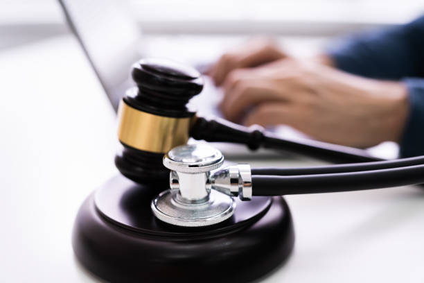 istock Mallet And Stethoscope On Gavel Over The Office Desk 1213741553