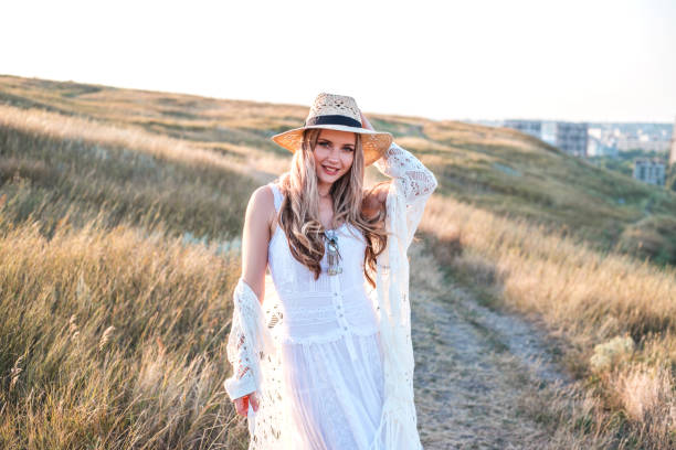 istock Beautiful woman enjoying nature outdoors at sunset. 1213743164