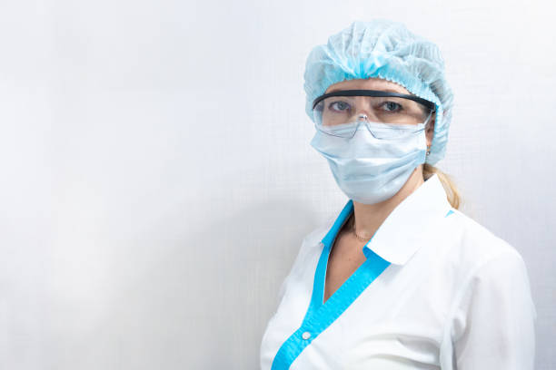 istock female doctor in mask and goggles with space copy space 1213743182