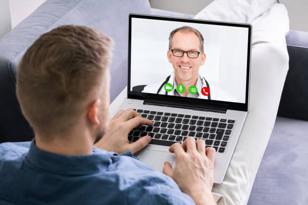 istock Man Videoconferencing With Doctor On Laptop 1213744453