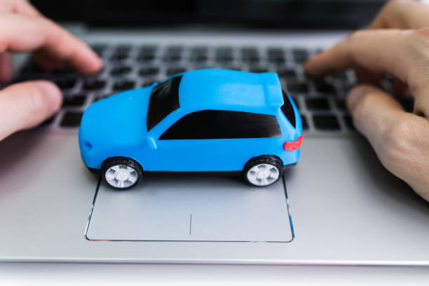 istock Blue Car On Laptop Keypad 1213744781