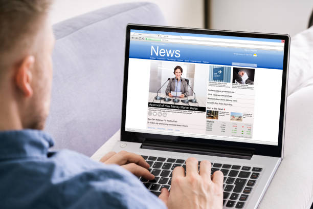 istock Man Reading News Website 1213744962