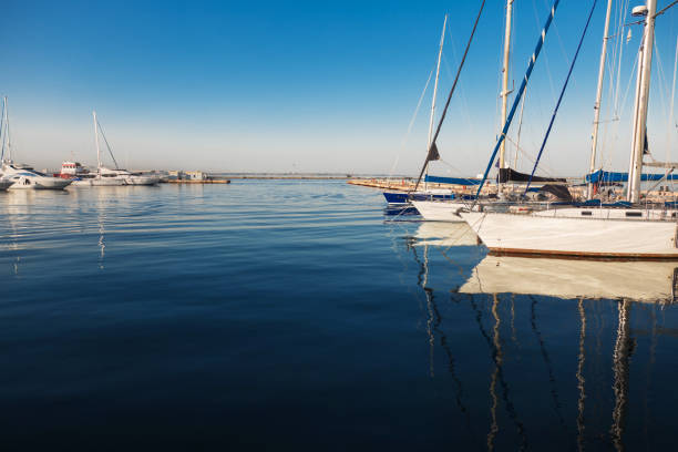 Yachts in the seaport on a calm summer day.