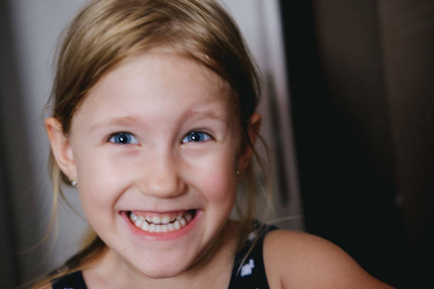 istock Young girl fooling around making faces 1213746681