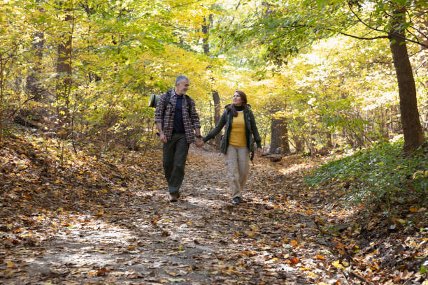 istock Couple hiking outside in nature 1213748461