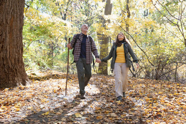 istock Couple hiking outside in nature 1213748463