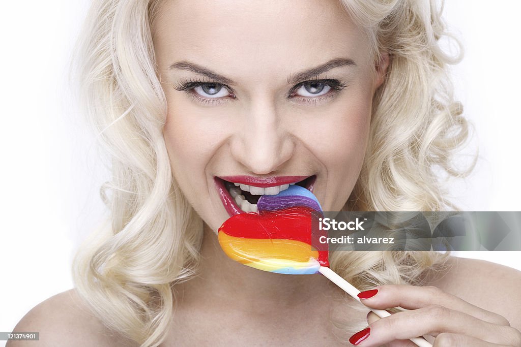 Chica comiendo dulces - Foto de stock de Adulto libre de derechos