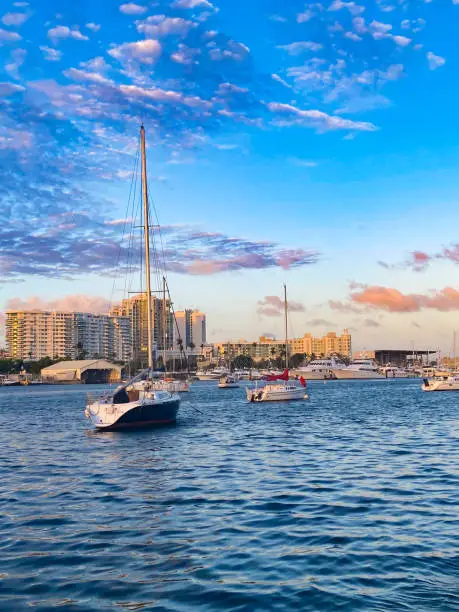 San Juan, Puerto Rico hotels and sailboats on the bay in neighborhood of Santurce,