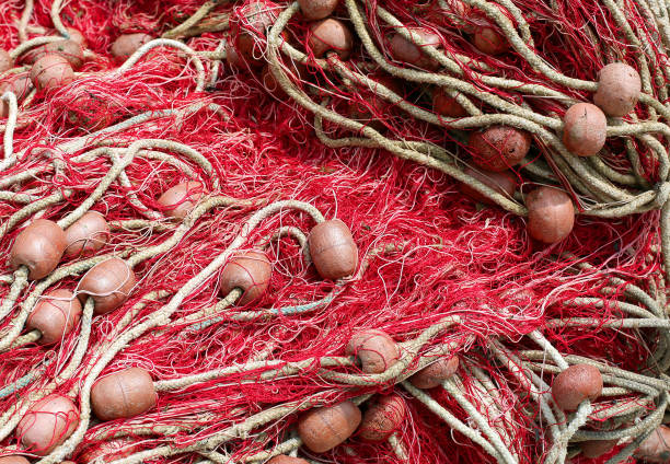 red fishing nets with floats used to fish