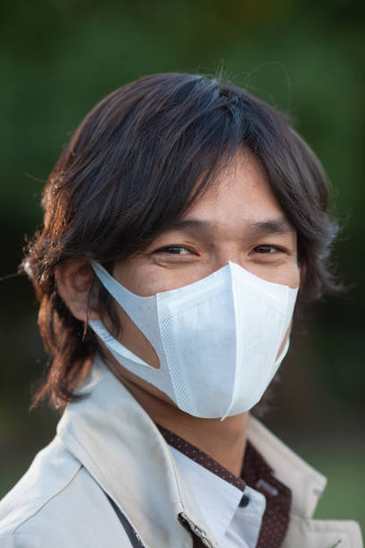 istock Japanese man with air pollution mask 1213752173