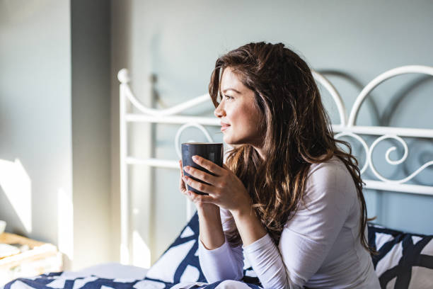 istock Young woman enjoying in her morning coffee 1213754971