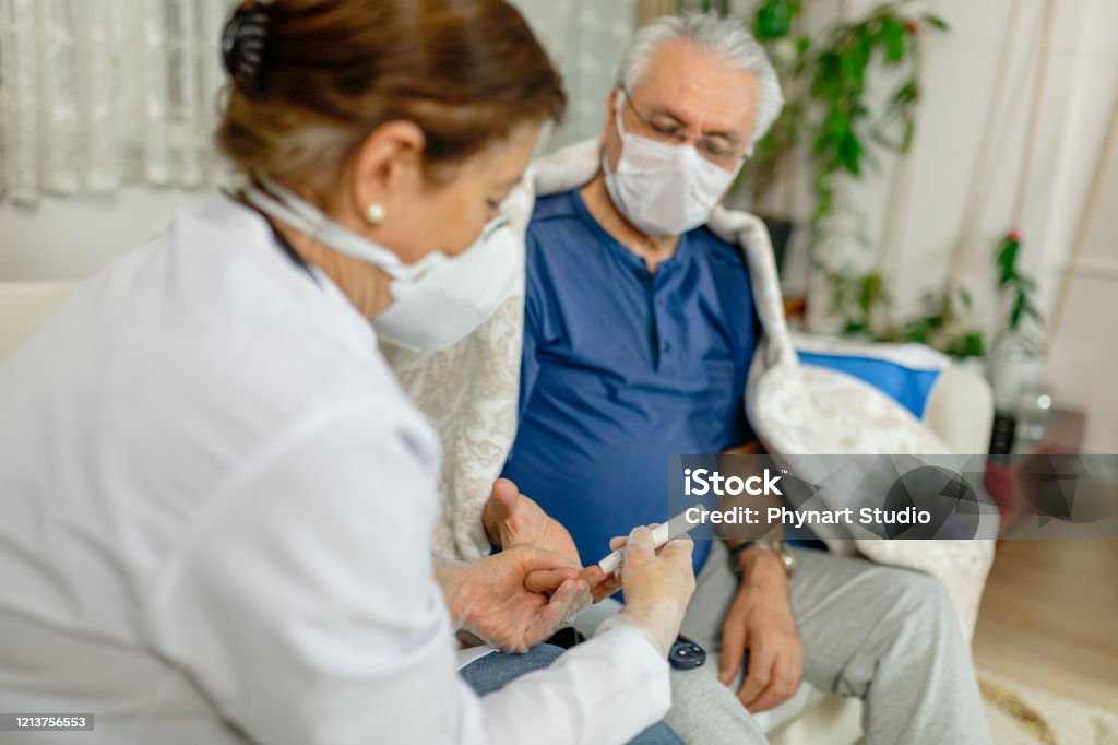 Theme diabetes.the man whose glucose was measured by going to the home of healthcare professionals. It uses the technology of an instrument for measuring the level of glucose in the blood Diabetes Stock Photo