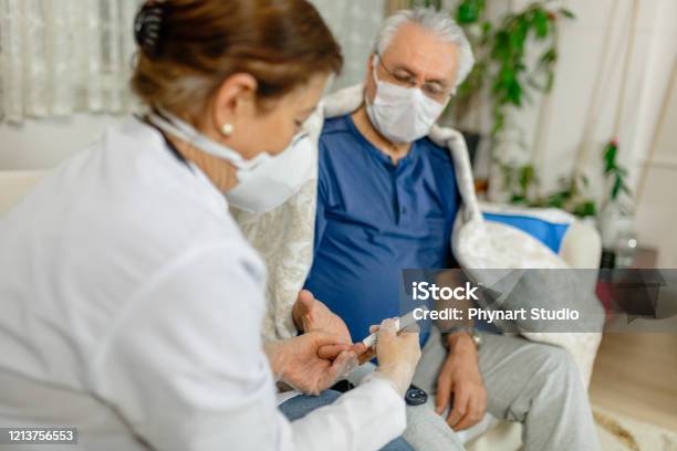 Theme Diabetesthe Man Whose Glucose Was Measured By Going To The Home Of Healthcare Professionals It Uses The Technology Of An Instrument For Measuring The Level Of Glucose In The Blood Stock Photo - Download Image Now