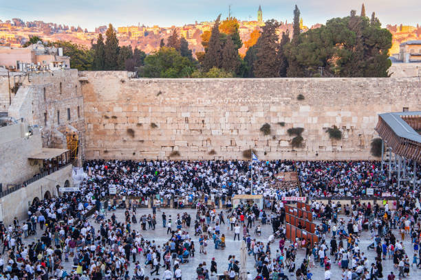 Sunrise. The blessing of the Cohenim Sunrise. The blessing of the Cohenim. Ceremony at the Western slope of the Temple Mount in the Old City of Jerusalem. Jews praying at the Western Wall. The concept of religious and photo tourism passover celebration stock pictures, royalty-free photos & images