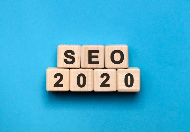 istock SEO 2020 text on wooden cubes on a blue background 1213759366