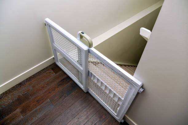 Baby gate at top of stairs stock photo