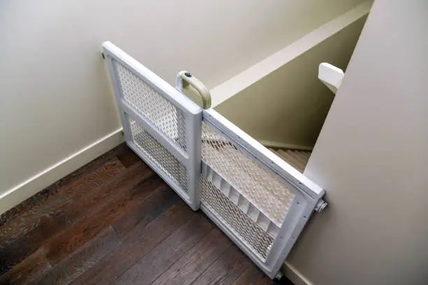 Photo of Baby gate at top of stairs