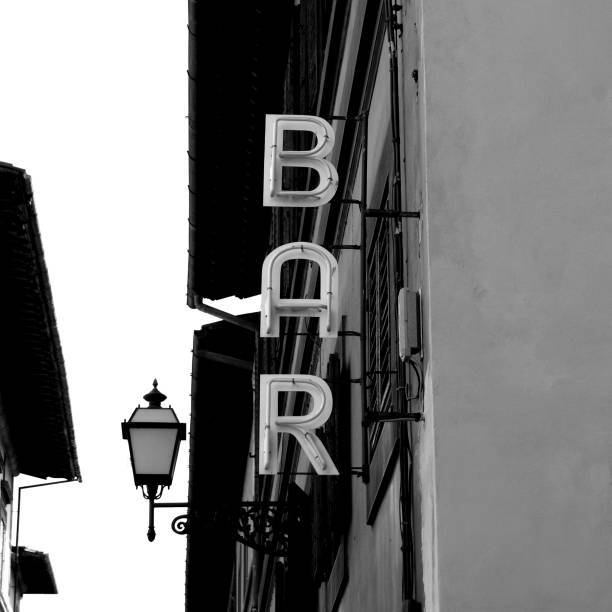 Vintage BAR in black and white Black and White Neon Lights spelling BAR in the street Vintage look las vegas photos stock pictures, royalty-free photos & images