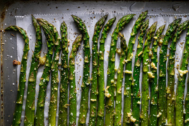 Roasted asparagus spears. Above shot, close up. asparagus stock pictures, royalty-free photos & images