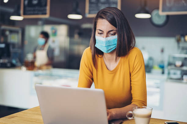 istock Woman working in cafe during virus epidemic 1213764545