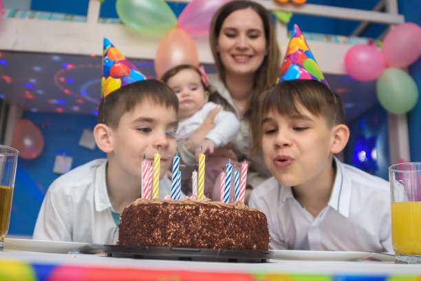 istock Children blew out candles on a holiday cake 1213765372