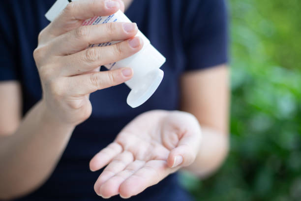 istock Women's hand using Alcohol gel for dealing with flu and virus prevention on hand 1213766406