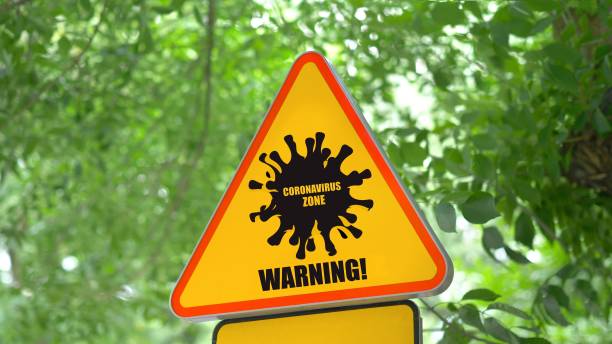 istock Street sign with Coronavirus COVID-19 1213766708