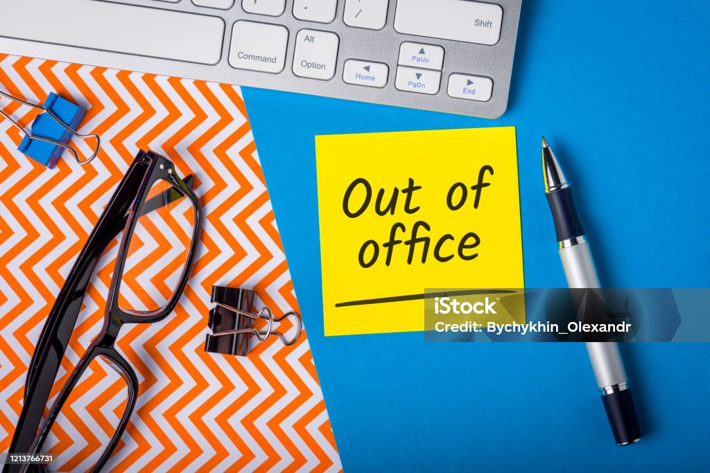Out of office - memo on office workplace. Holiday Announcement, Day Off or Quarantine Covid-19 Out of office - memo on office workplace. Holiday Announcement, Day Off or Quarantine Covid-19. Vacations Stock Photo