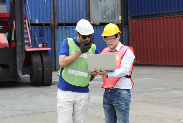 istock Worker inspecting cargo shipping containers. before departure. 1213767458