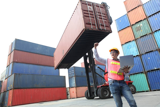 istock Worker inspecting cargo shipping containers. before departure. 1213767468