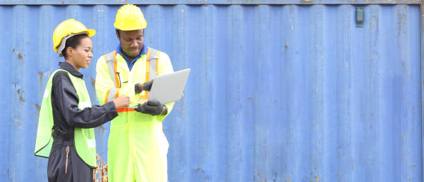 istock Close up of An African American handsome black engineer he is working in container box yard area 1213767610