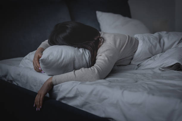 istock awake woman having insomnia and lying on pillow at night 1213769506