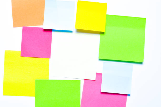 istock Lots of post its on white background with a different symbols on it 1213769874