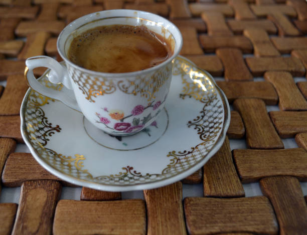 istock coffee in a vintage cup. Wood background 1213775174