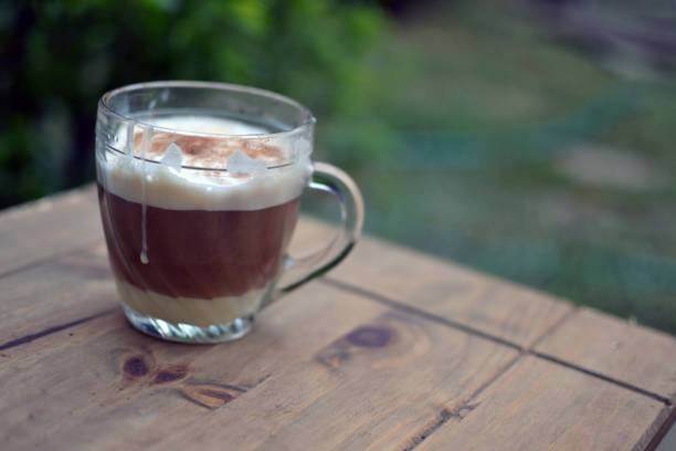 istock black coffee with condensed milk and latte 1213775196