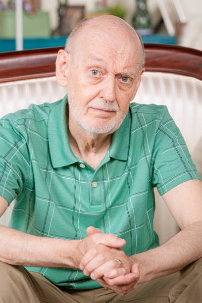 istock Sad or Depressed Senior Man on Couch at Home 1213775579