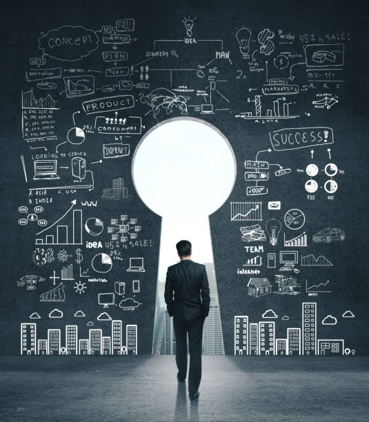 istock Businessman looking on drawing business sketch on concrete wall 1213776712