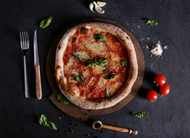 istock Pizza Margherita on a cutting board 1213777280