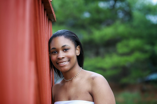 A portrait of a beautiful African-American teenaged girl outdoors